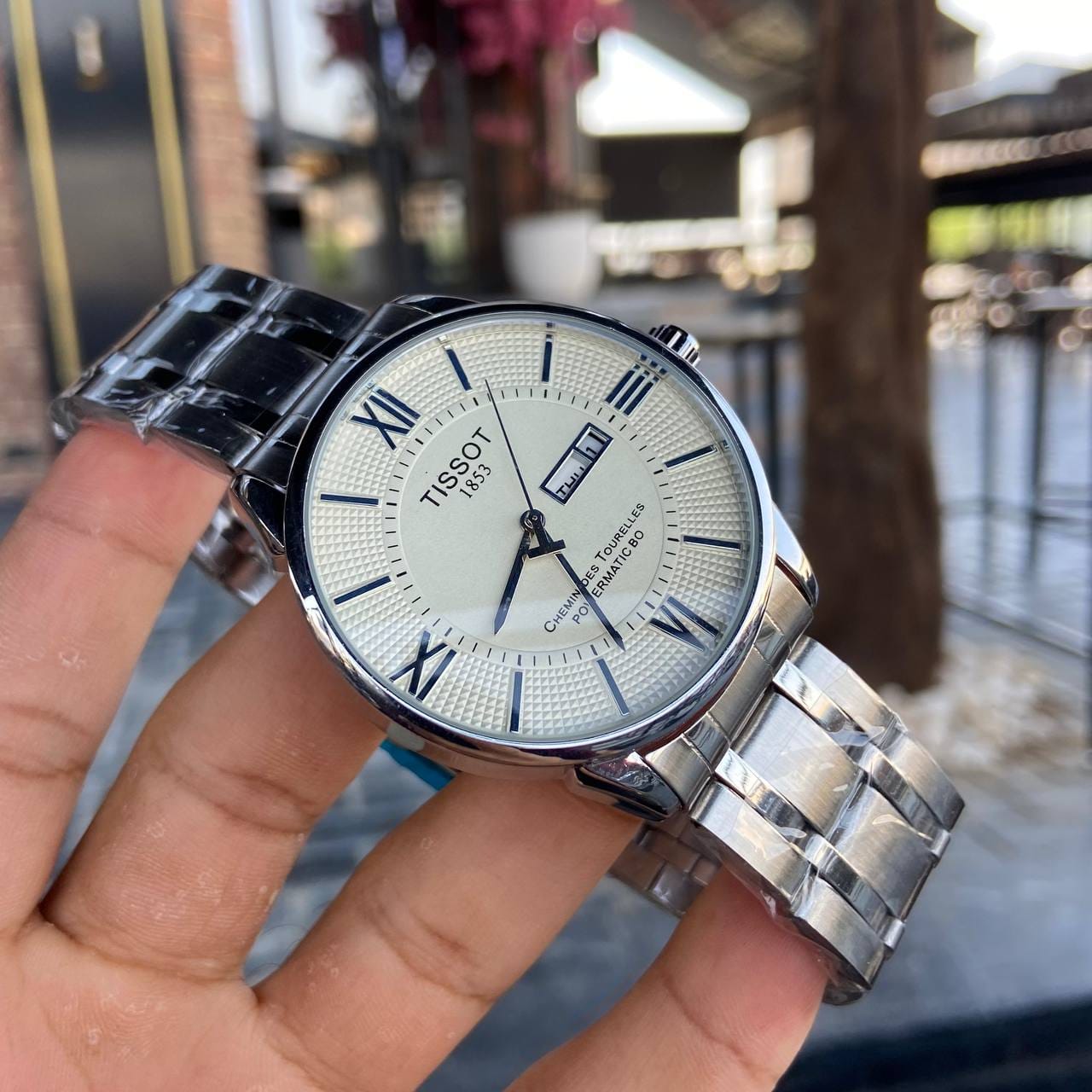 ساعة Tissot Stainless Steel Day-Date لون سيلفر ومطعم ميناء اسود وابيض