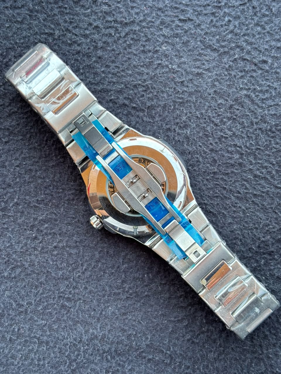 ساعة Patek Philippe Silver Watch – White Dial, Date Display & Transparent Case Back